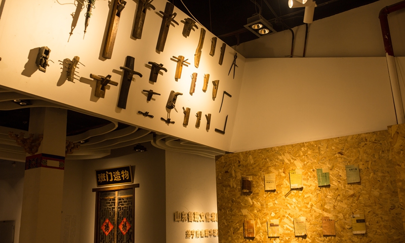Carpentry tools and handbooks are displayed at the workshop of Lu Ban Culture Development Company in Jining. Photo: Shan Jie/GT